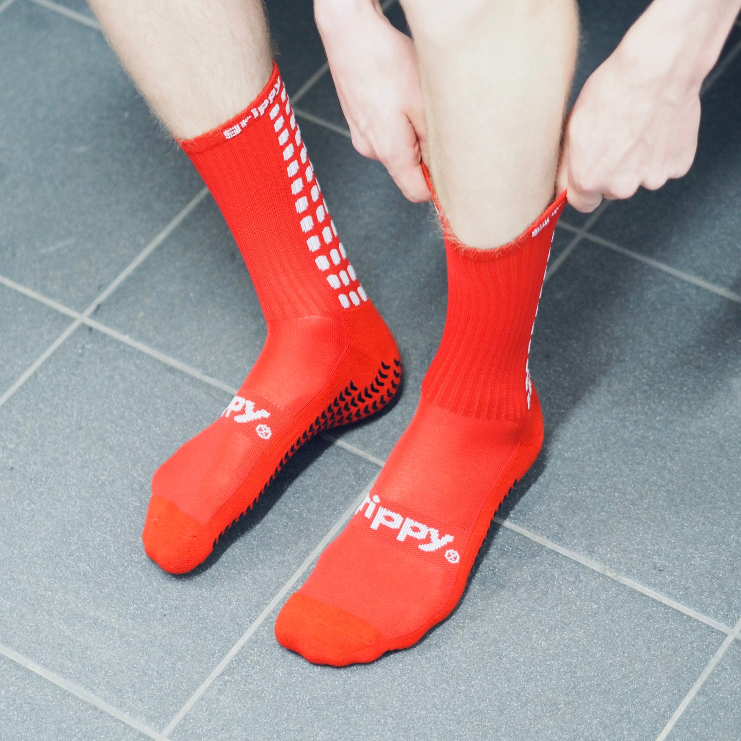 Red football grip socks football changing rooms
