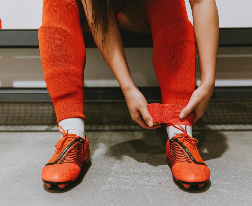 Football under wrap for sports. Football tapes and strapping. Football grip socks.